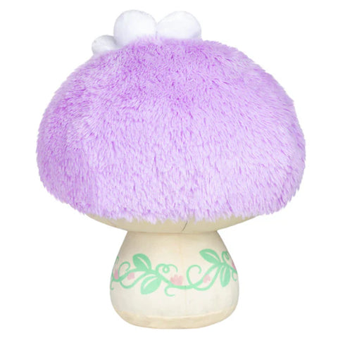 Image shows a back view of the stuffed pastel purple mushroom