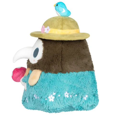 Image shows a side view of the stuffed spring mushroom themed plague doctor