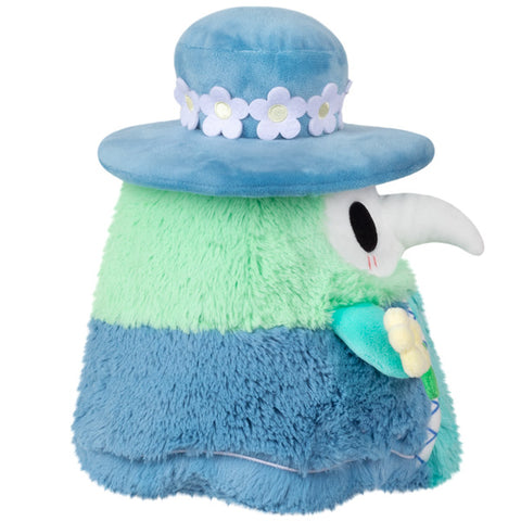 Image shows a side view of the spring themed stuffed plague doctor