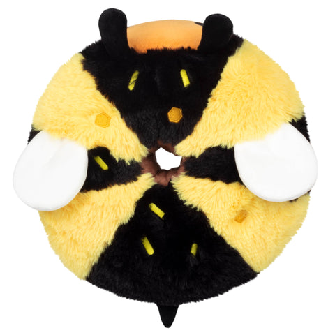 A top-down view of the plush doughnut shaped bee