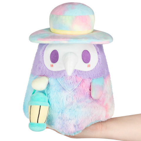Image shows a stuffed pastel-colored tie dye plague doctor