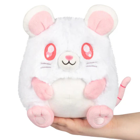 Plush toy shaped like a white rat with pink accents held in a hand on a white background