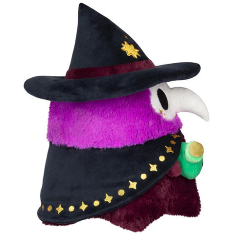 Image shows a side view of the stuffed witchy plague doctor. He is purple and wears a black witch hat.