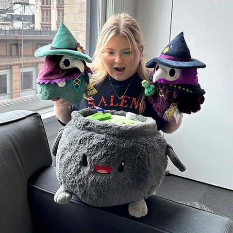 Image shows a woman holding the witchy set. Each stuffy is approximately the size of her head.