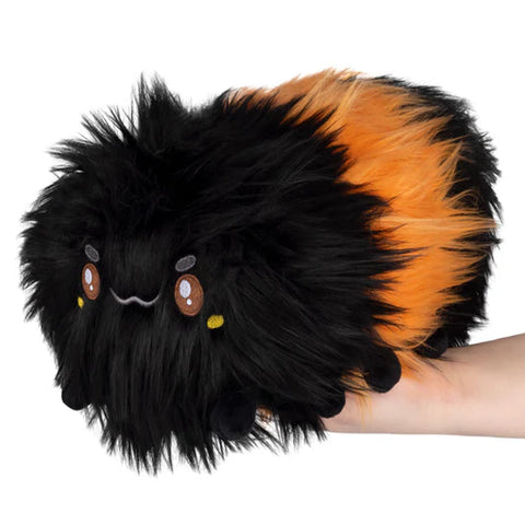 Image shows a stuffed wooly black and orange caterpillar