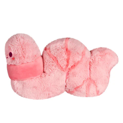Image shows a side view of the stuffed pink worm. It is scrunched up like it is moving.