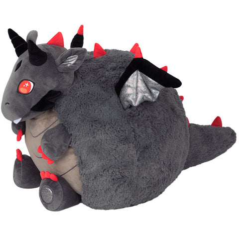 A side view of the plush dragon