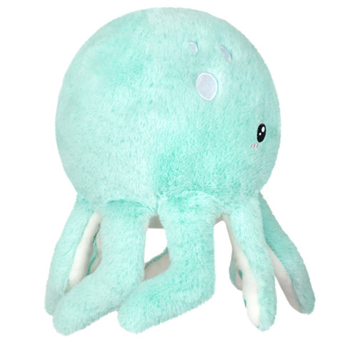 A side view of the plush mint octopus