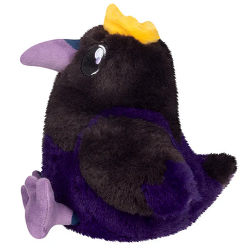 Image shows a side view of the stuffed king raven