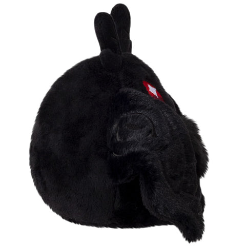 A side view of the plush baby Mothman