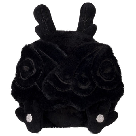 A front view of the plush baby Mothman with his wings closed. They are held together by magnets.