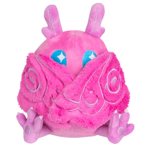 Image shows a front view of the pink stuffed baby mothman with his wings closed