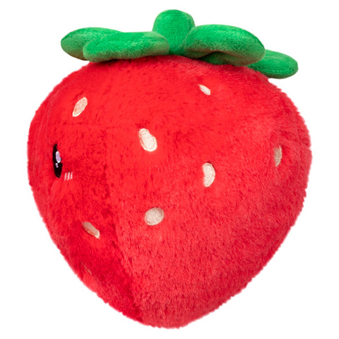 A side view of the plush strawberry