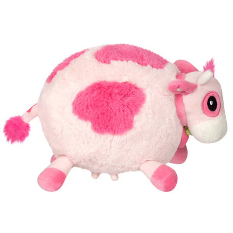 Image shows a side view of the stuffed pink cow