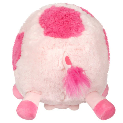 Image shows a back view of the stuffed pink cow