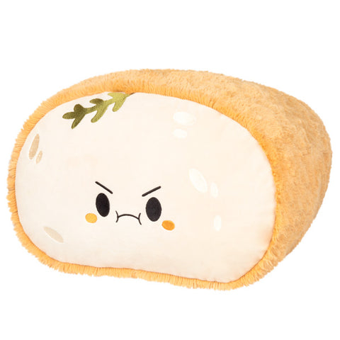 Image shows a stuffed loaf of sourdough bread with a grumpy face