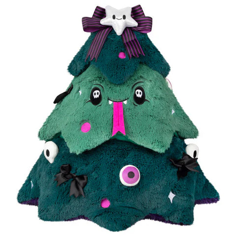 Image shows a spooky Christmas tree. Its face has its tongue out, it is covered with eyeballs and bows.