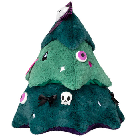 Image shows the side view of the spooky Christmas tree. You see an eyeball, a skull, and a black bow.