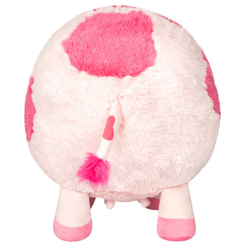 Image shows a back view of the pink stuffed cow. You can see its udder.