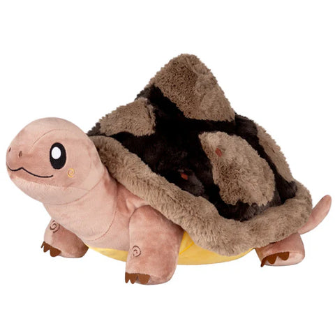 Image shows a stuffed giant tortoise. Its shell is black and brown.
