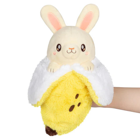 Image shows a stuffy that is a banana on the bottom and a bunny on the top,