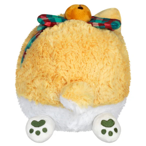 The back view of A round stuffed Corgi with a bow tied around its middle