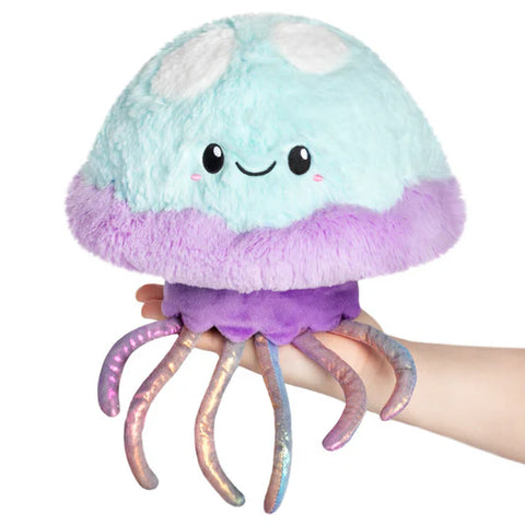 Image shows a light blue and lavender stuffed jellyfish with holographic-type tentacles. 
