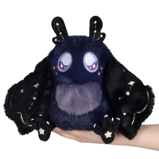 Image shows a purple mothman with lavender eyes. There are constellations on his wings and antennae.