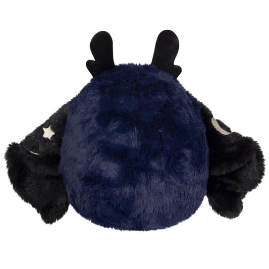 Image shows a back view of the midnight mothman