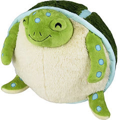 Image shows a stuffed sea turtle sitting on its butt