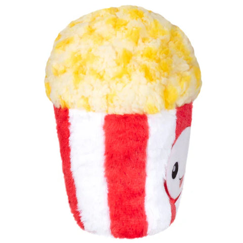 The side view of a stuffed tub of popcorn