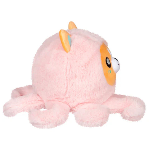 Image shows a side view of the stuffed Corgi in an octopus costume