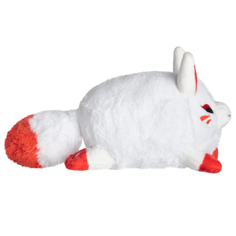 Image shows a side view of the stuffed Kitsune