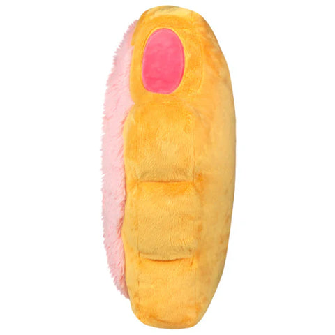 Side view of the plush toaster tart on a white background. It has a bite out of the top corner.