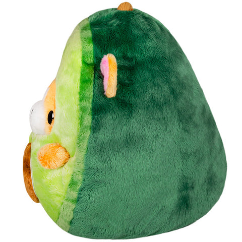 Image shows a side view of the stuffed corgi in an avocado suit