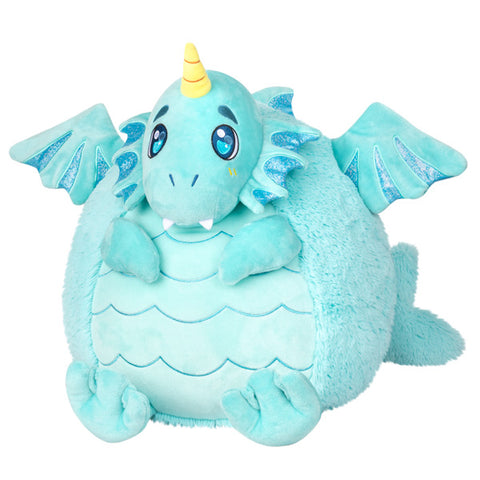 A plush toy depicting a blue water dragon with wings, a horn, and a smiling face.