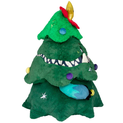 The side view Christmas tree with teeth, arms, various shapes scattered around the tree, and a star with a shocked face.