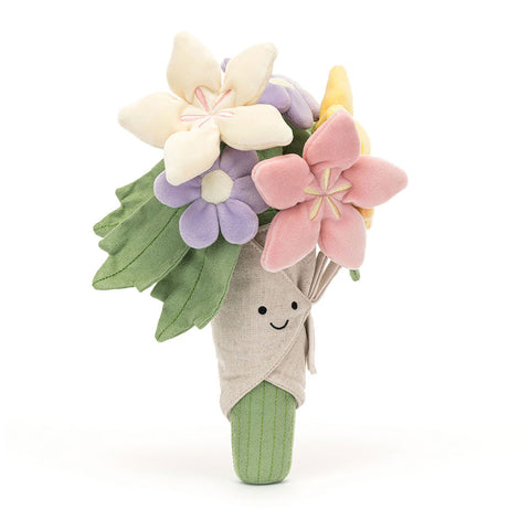 Image shows a stuffed bouquet of flowers. The flowers are pastel and wrapped in brown stuffed paper.