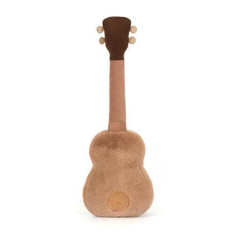 Image shows a back view of the stuffed ukulele. It has the jellycat logo embroidered on its back.