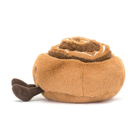 Side view of the Plush cinnamon roll toy on a white background