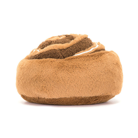 A back view of the plush cinnamon bun on a white background