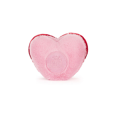 A back view of a plush pink macaron cookie. It has the jellycat logo embroidered into the back.