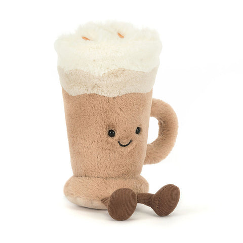 Image shows a stuffed latte in a mug, topped with whipped cream. It has a happy face and feet.