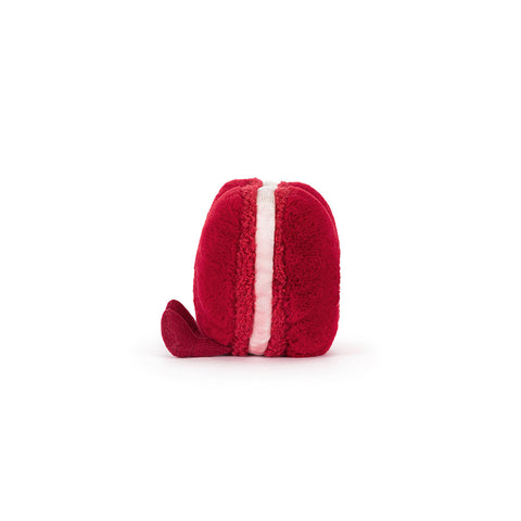 Side view of a red macaron cookie
