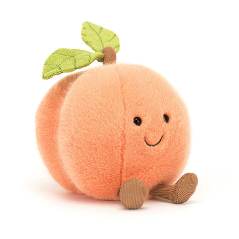 Image shows a fuzzy stuffed peach. It has a happy face and feet.