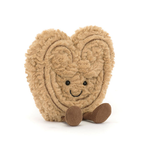 Plush heart-shaped pastry with a happy face and feet