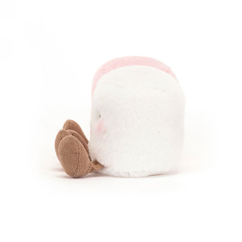 Side view of the pair of marshmallows, showing the white one.