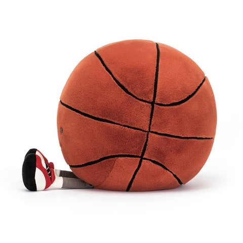 Side view of a Plush basketball with shoes on a white background