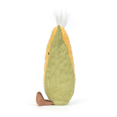 Plush toy shaped like a corn on a white background