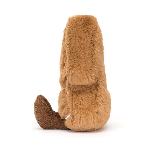 Side view of a plush tree-shaped cookie toy on a white background
